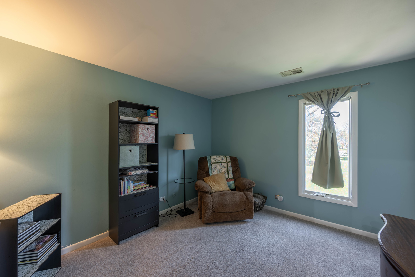 1495 South County Farm Road, Unit 23 Wheaton, IL 60189 - Photo 4 of 21 a living room with furniture and a window