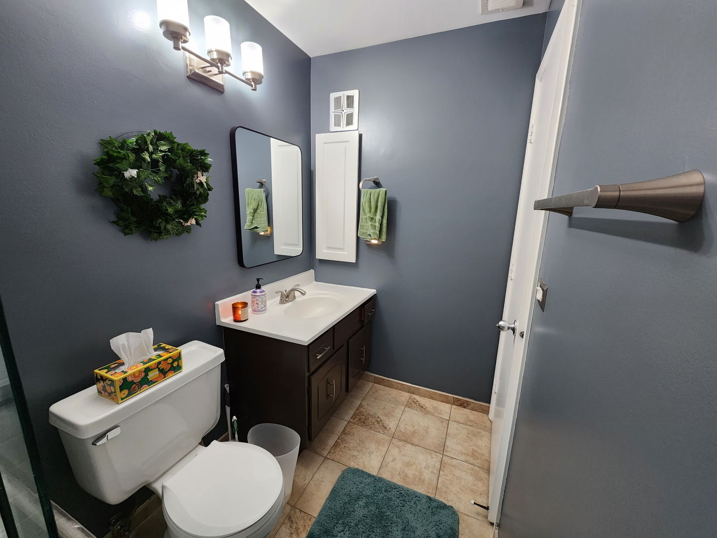 1495 South County Farm Road, Unit 23 Wheaton, IL 60189 - Photo 5 of 21 a bathroom with a sink vanity mirror and toilet