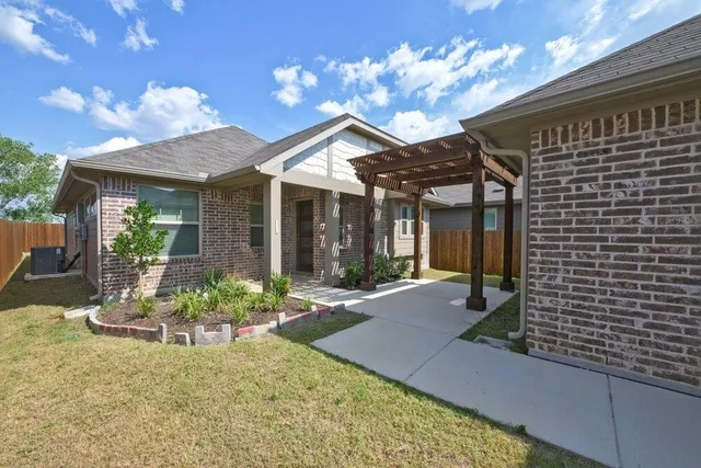 a view of a chair and table in patio of the house