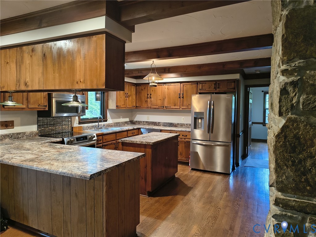2174 Grubby Road Halifax, VA 24558 - Photo 25 of 25 a kitchen with stainless steel appliances a refrigerator a sink and wooden cabinets