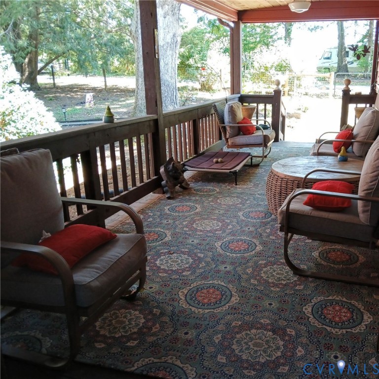 2174 Grubby Road Halifax, VA 24558 - Photo 10 of 25 a outdoor living space with furniture and a floor to ceiling window