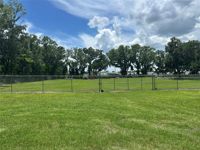 a view of a golf course with a big yard