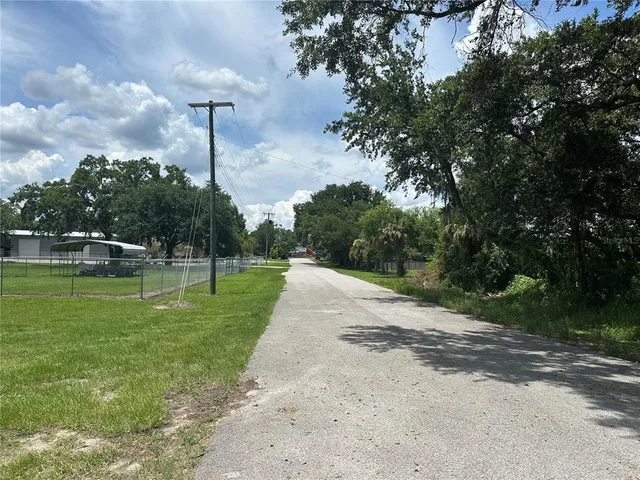 a swimming pool with lots of trees
