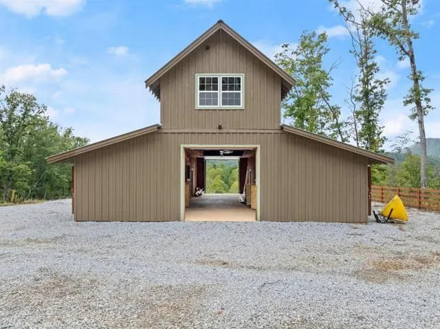 a view of a house with a yard and garage