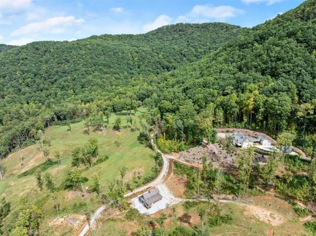 a kitchen with stainless steel appliances granite countertop a stove a refrigerator and a microwave