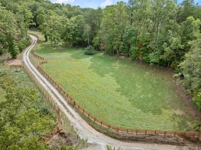 a backyard of a house with lots of green space