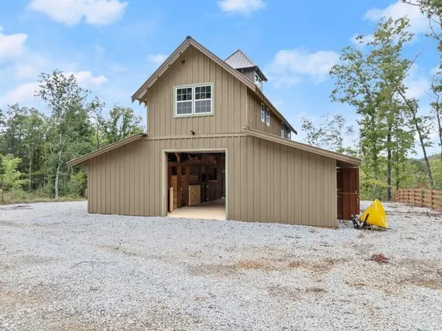 a kitchen with stainless steel appliances granite countertop a stove a refrigerator and a microwave