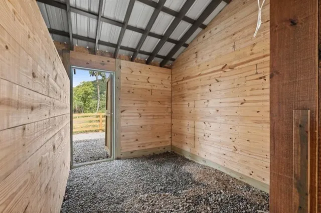 a kitchen with stainless steel appliances granite countertop a refrigerator and a stove