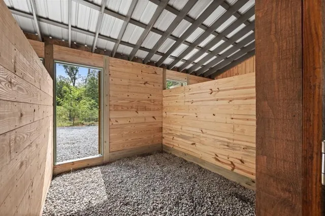a view of outdoor space with green field and trees all around