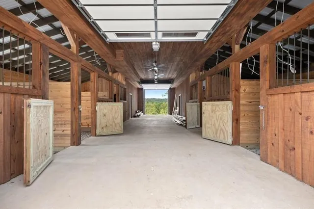 a view of an empty room and wooden floor