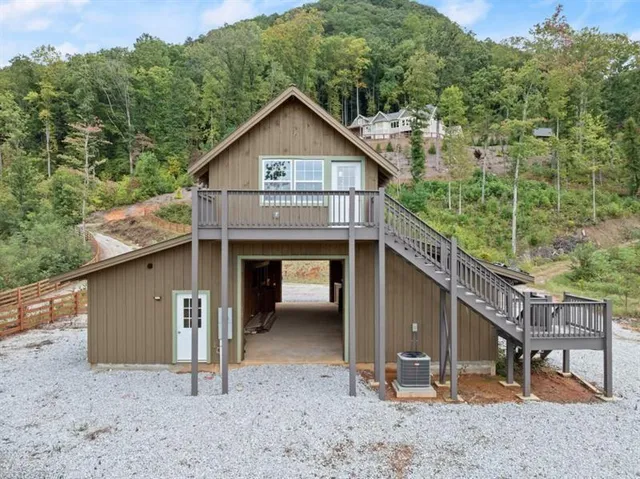 a view of a house with a yard and roof