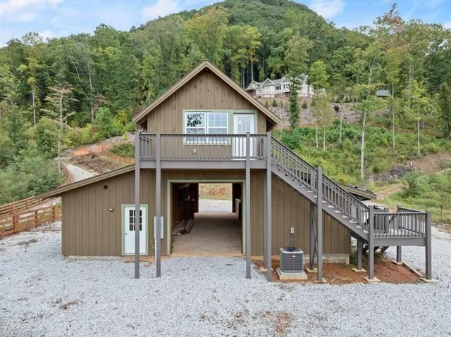 a view of a house with a yard and roof