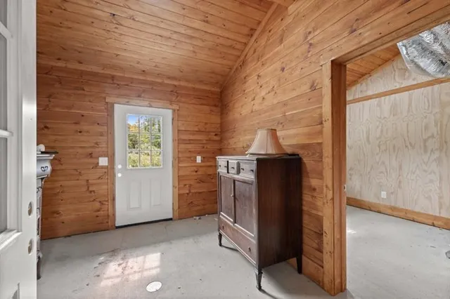a balcony with wooden floor and fence