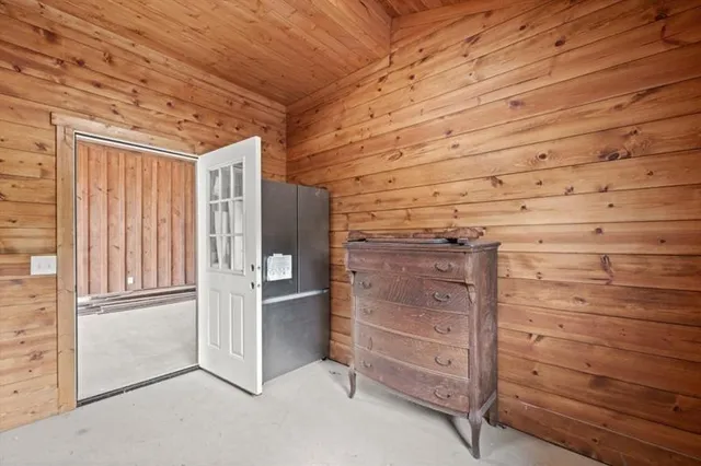 a view of a porch with wooden floor and fence