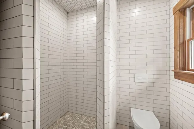 a view of a work space with wooden floor and furniture