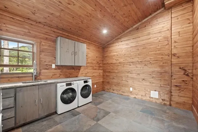 a view of a livingroom with wooden floor and a ceiling fan