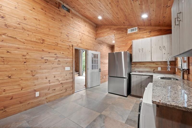144 David Drive Tiger, GA 30576 - Photo 40 of 71 a kitchen with stainless steel appliances granite countertop a refrigerator and a stove