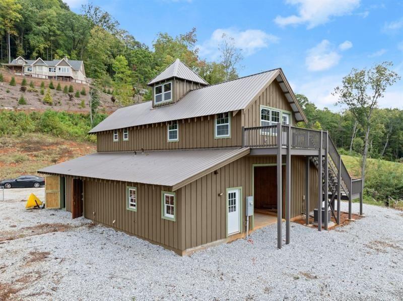 144 David Drive Tiger, GA 30576 - Photo 4 of 71 a view of a house with a yard and roof