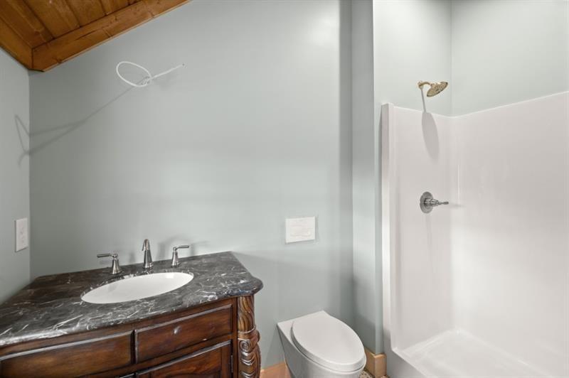 144 David Drive Tiger, GA 30576 - Photo 63 of 71 a bathroom with a granite countertop sink toilet and shower