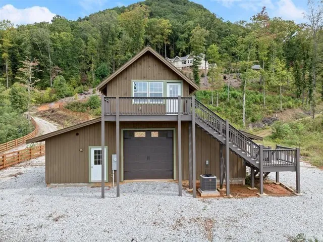 a view of a house with a backyard