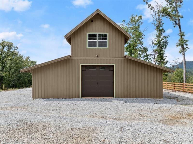 144 David Drive Tiger, GA 30576 - Photo 9 of 71 a front view of a house with a yard and garage