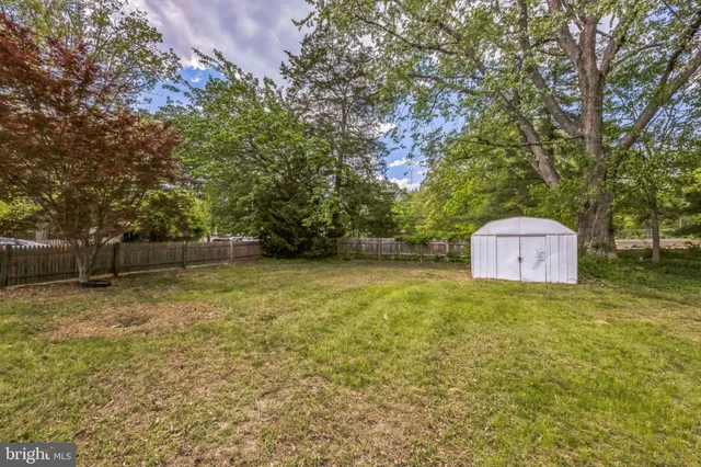 a backyard of a house with a trees