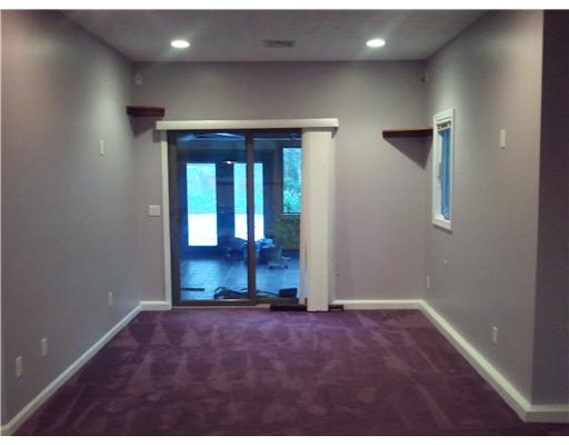 5656 Flat River Road Coventry, RI 02827 - Photo 16 of 19 Den/Family/Great Room. More living space leads out to 3 season room