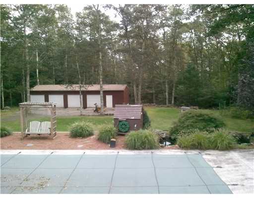 5656 Flat River Road Coventry, RI 02827 - Photo 4 of 19 Exterior Back. In-Ground pool and fish pond with working water wheel
