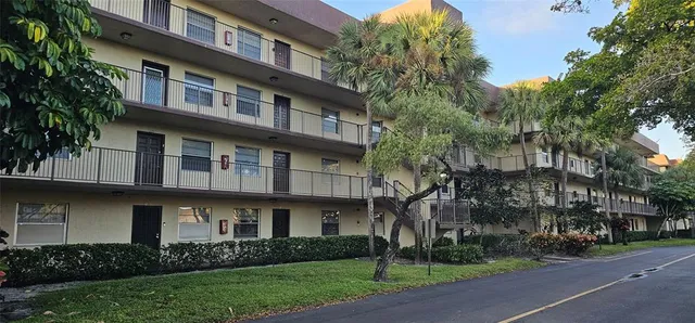 a view of a building with a yard