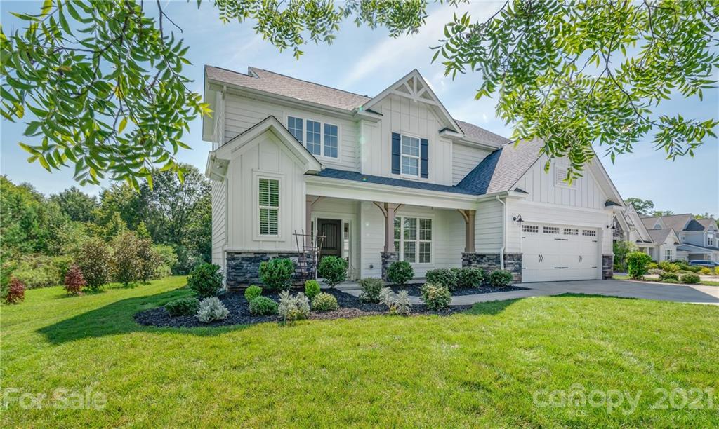 2701 Walker Road Matthews, NC 28105 - Photo 2 of 32 a front view of a house with a yard and potted plants