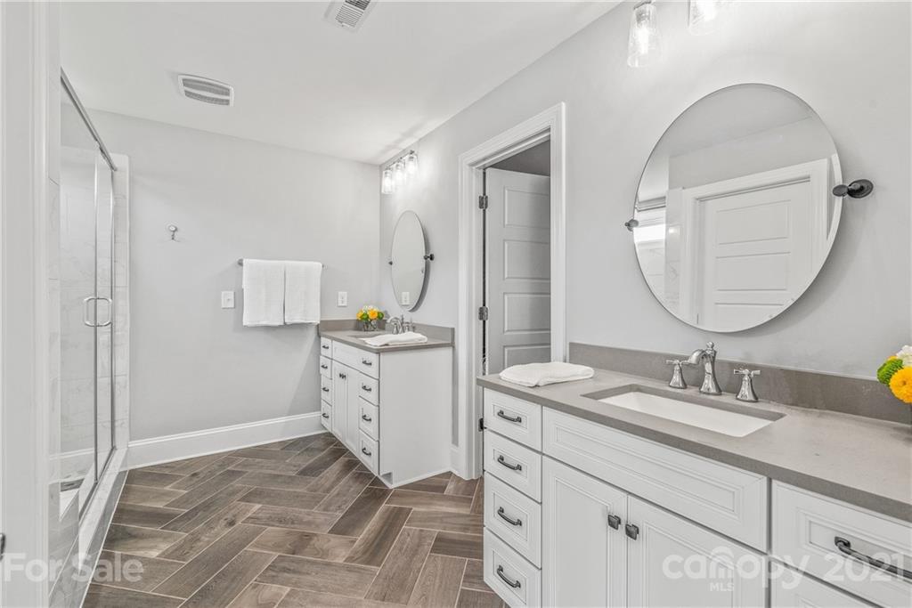 2701 Walker Road Matthews, NC 28105 - Photo 14 of 32 a bathroom with a sink vanity and a mirror