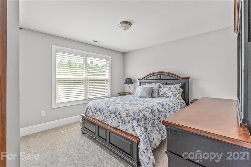 2701 Walker Road Matthews, NC 28105 - Photo 18 of 32 a bedroom with a bed and window