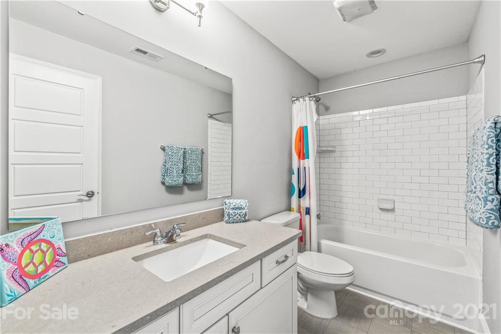 2701 Walker Road Matthews, NC 28105 - Photo 19 of 32 a bathroom with a sink toilet vanity and shower