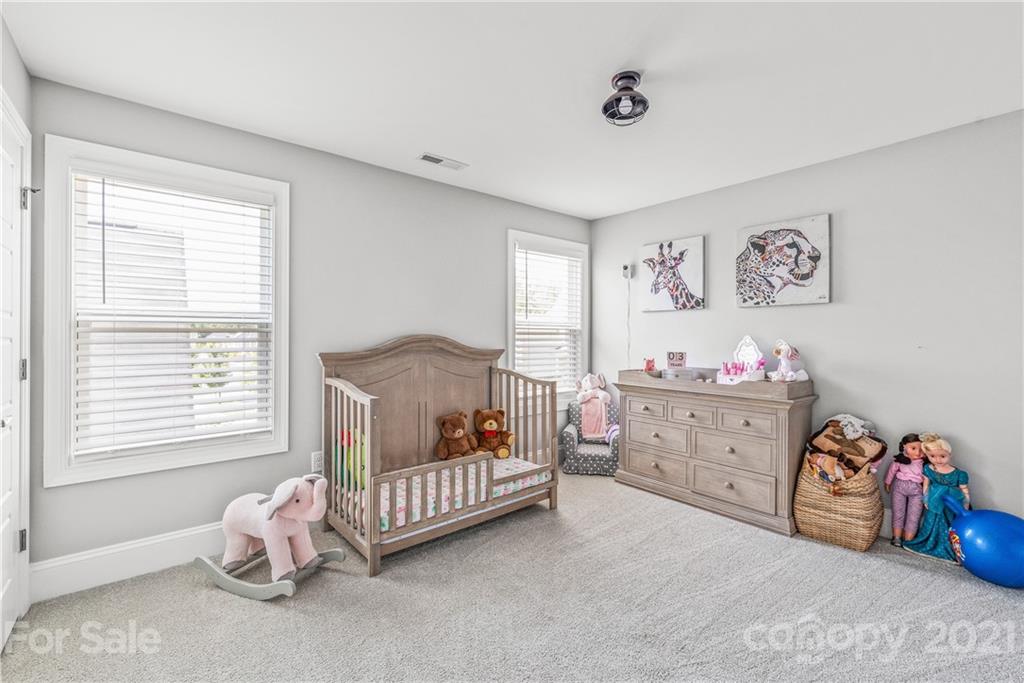 2701 Walker Road Matthews, NC 28105 - Photo 20 of 32 a bedroom with a bed and a window
