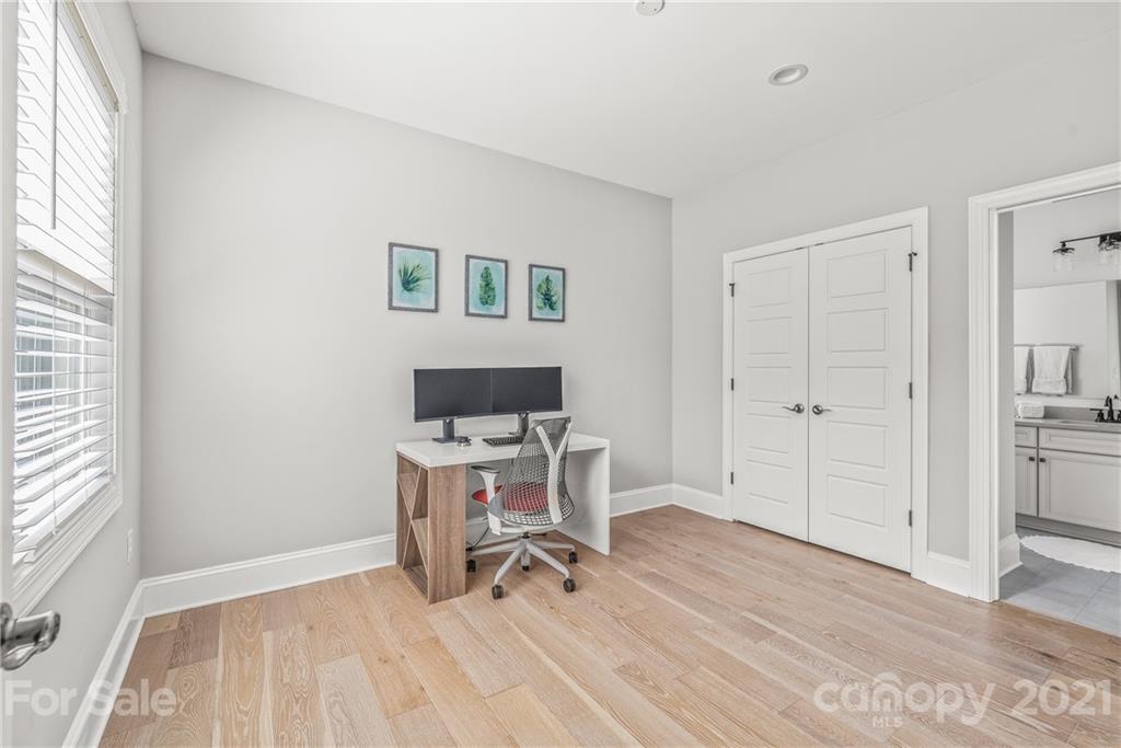 2701 Walker Road Matthews, NC 28105 - Photo 22 of 32 a view of a workspace with furniture and wooden floor
