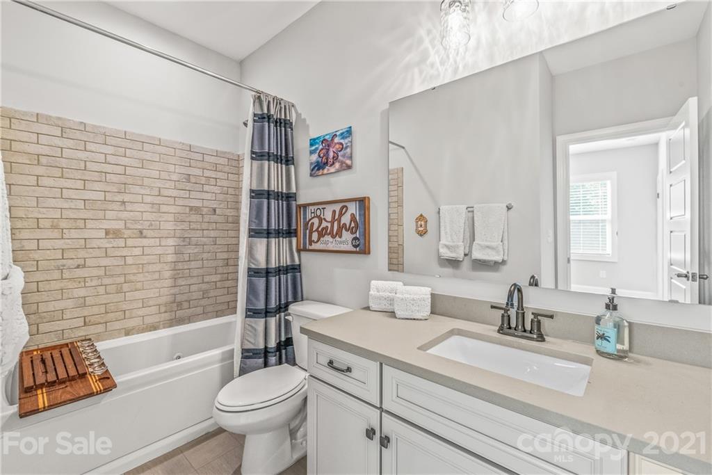 2701 Walker Road Matthews, NC 28105 - Photo 23 of 32 a bathroom with a sink a toilet and shower