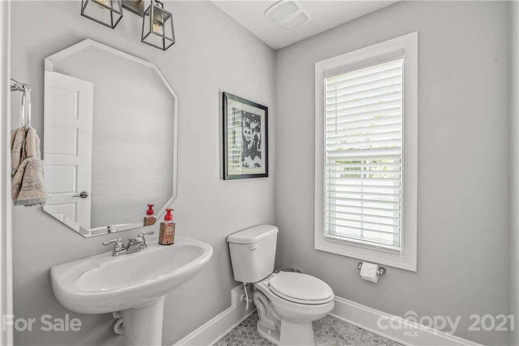 2701 Walker Road Matthews, NC 28105 - Photo 25 of 32 a bathroom with a sink toilet and a mirror