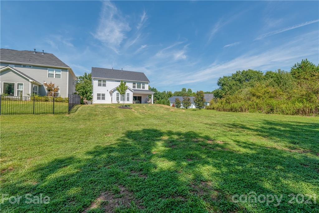 2701 Walker Road Matthews, NC 28105 - Photo 29 of 32 a view of a big room with a big yard and plants