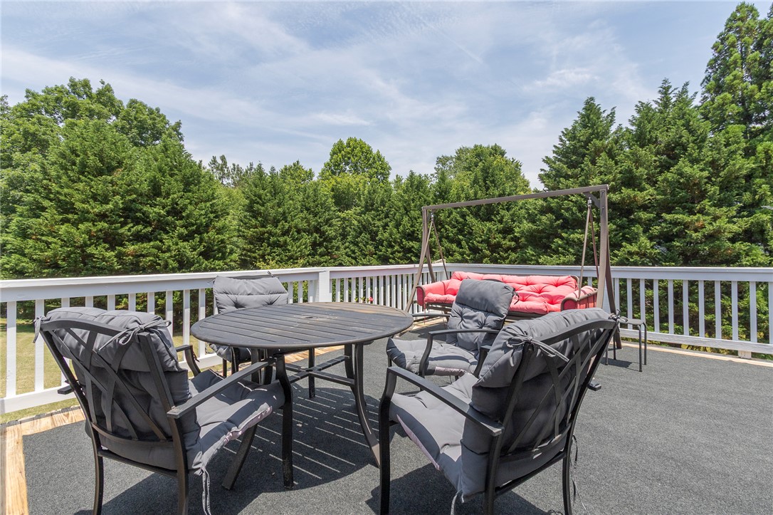 861 North Old Pendleton Road Liberty, SC 29657 - Photo 34 of 45 An inviting deck offers a perfect spot for outdoor relaxation and entertaining amidst verdant surroundings.