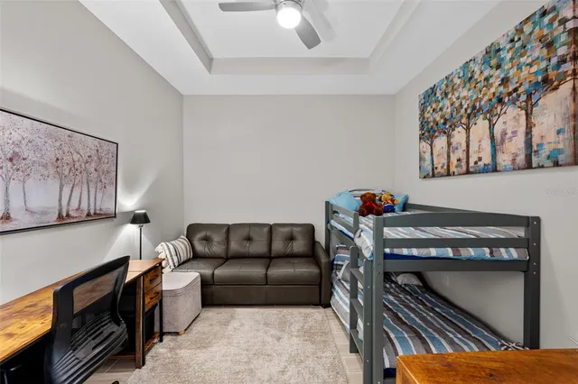 a livingroom with furniture workspace and a window