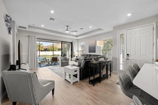 a living room with furniture and a large window