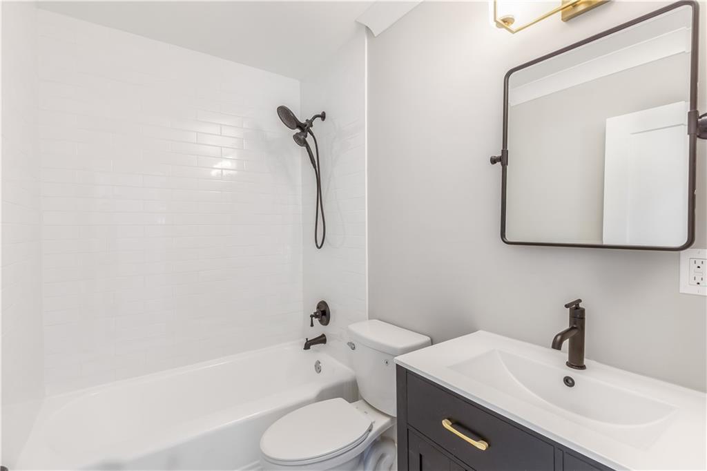 2260 Old Spring Road Smyrna, GA 30080 - Photo 24 of 29 a bathroom with a sink toilet and shower