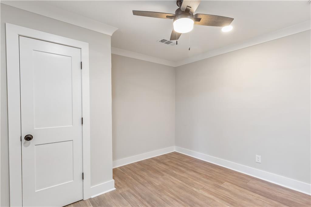 2260 Old Spring Road Smyrna, GA 30080 - Photo 25 of 29 a view of an empty room with wooden floor