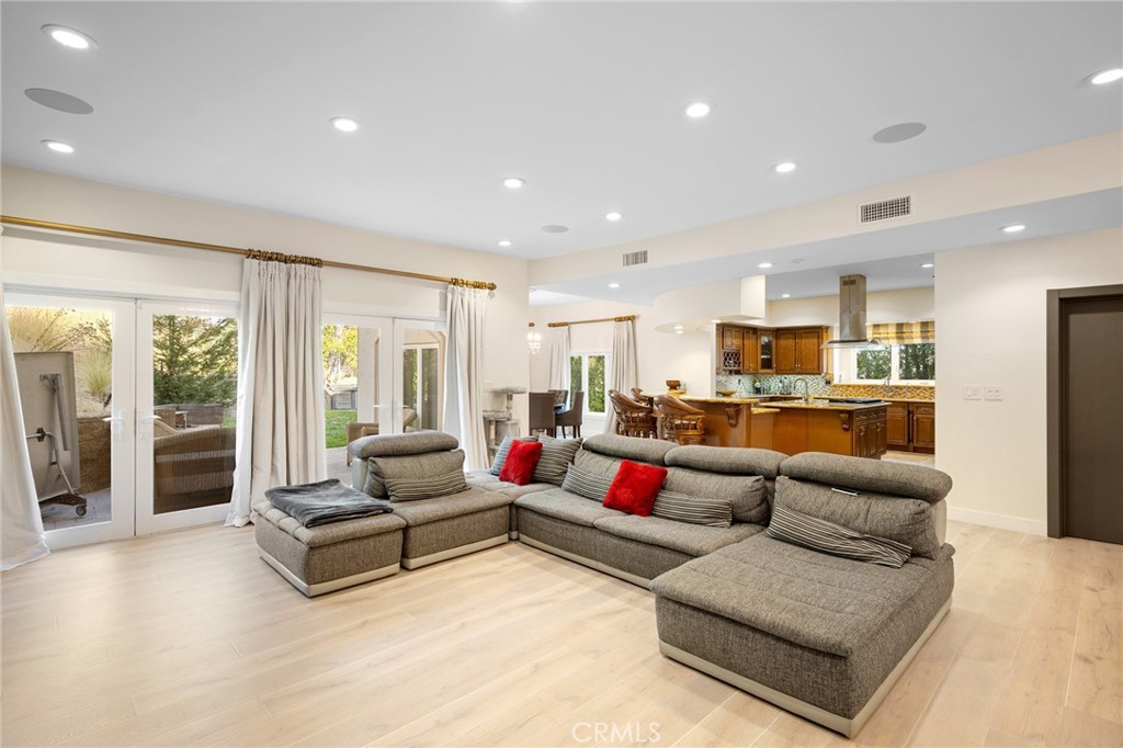 3331 Oakmont View Drive Glendale, CA 91208 - Photo 15 of 50 a living room with furniture kitchen view and a large window