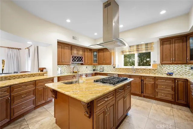 a kitchen with a stove top oven sink and cabinets
