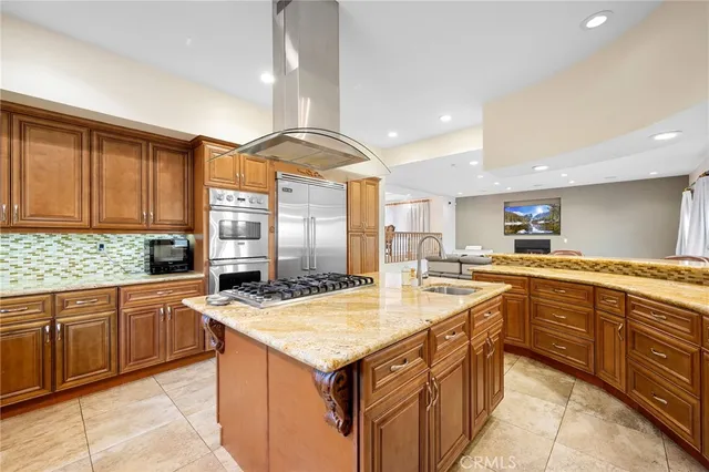 a kitchen with a stove sink and cabinets