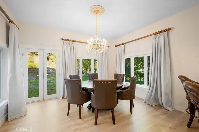 a dining room with furniture and window