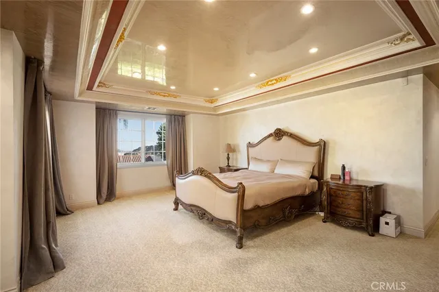 a spacious bedroom with a bed and a window