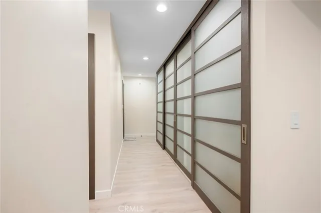 a view of entryway with wooden floor