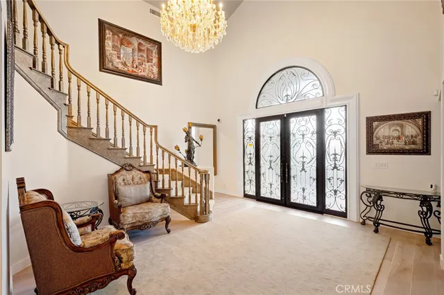 a view of a livingroom with furniture and a large window